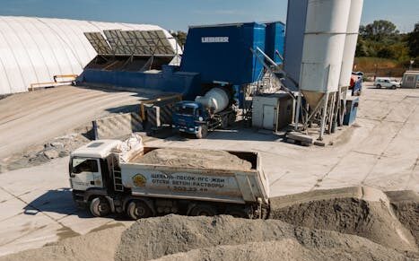 Aerial view of a concrete batching plant with dump truck in Novosibirsk, Russia.